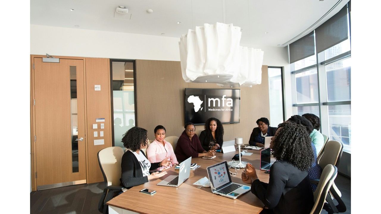 Medicines for Africa team meeting in a boardroom